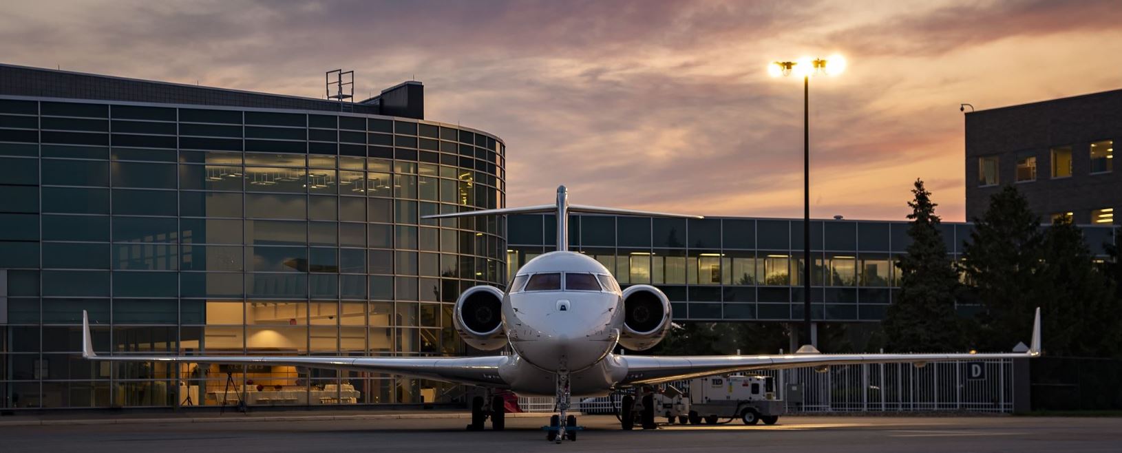 Business jet on the ramp at dusk